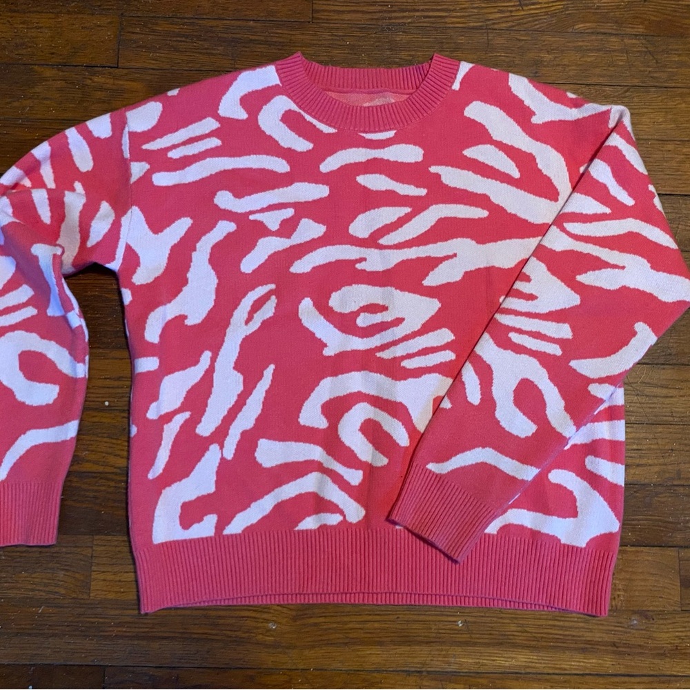 Vibrant Pink Sweater with White Patterns